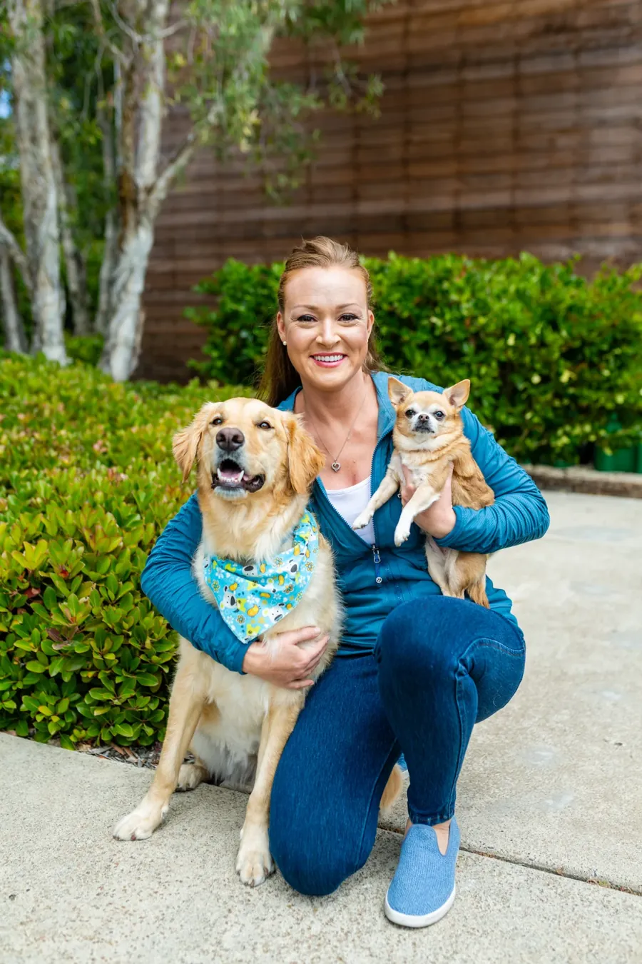 Melanie, founder of True Pet Kitchens, with her golden retriever and chihuahua