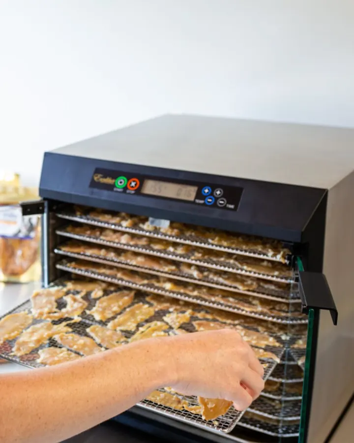 A tray of jerky treats coming out of the dehydrator