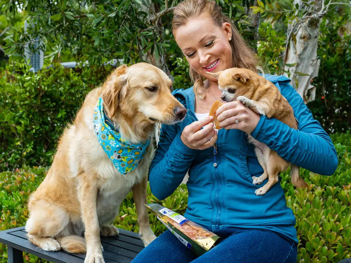 Melanie, founder, with her golden retriever and Chihuahua